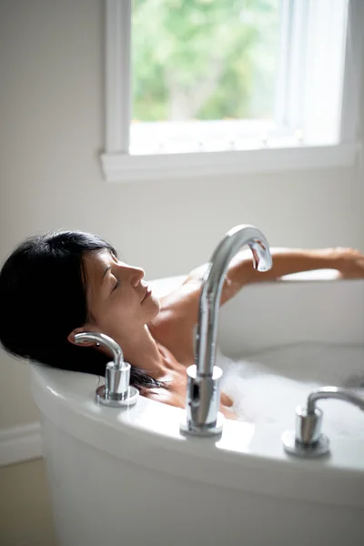 Mature woman in a bathtub — Stock Photo, Image