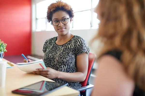 Unposed group of creative business people in an open concept office brainstorming their next project. — Stock Photo, Image