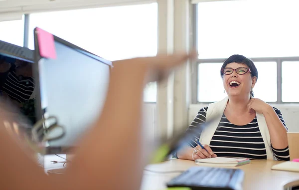 Unposed group of creative business people in an open concept office brainstorming their next project. — Stock Photo, Image