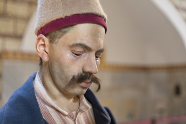 Bir Zuluflu görevlisi, Topkapı Sarayı, Istanbul, Türkiye'nin Shot kadar kapatın