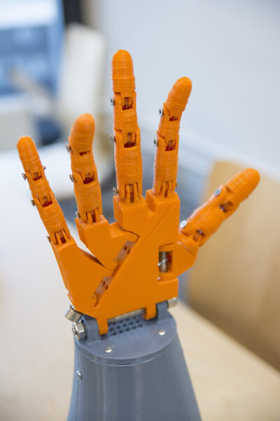 Orange Colored Robotic Hand Stock Picture