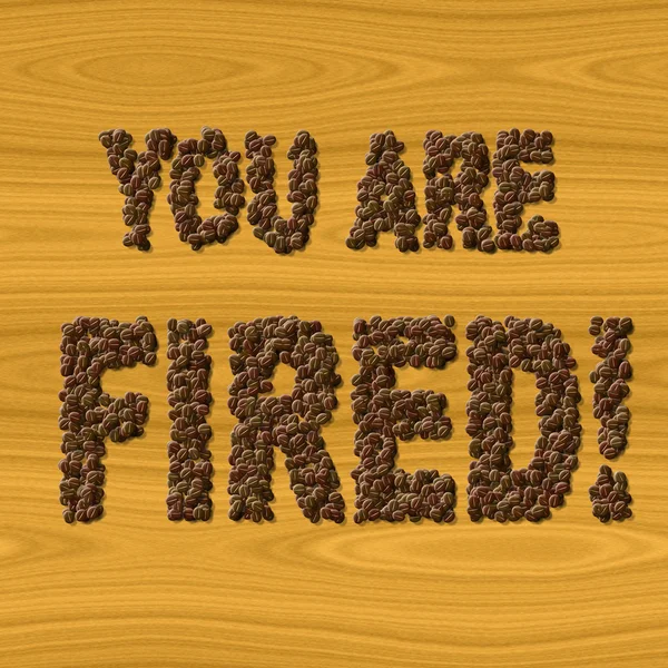 Text You Are Fired coffee on wood texture — Stock Photo, Image