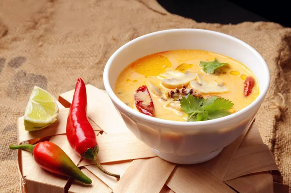 Tom Yam soup on burlap surface. Hot Thai soup