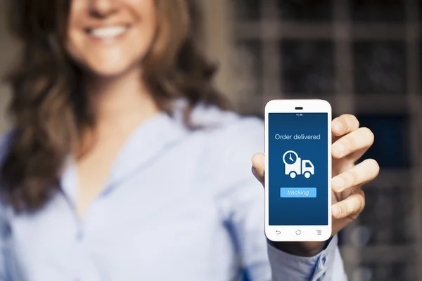 Woman showing her mobile phone. — Stock Photo, Image