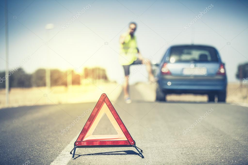 Emergency triangle on the road.