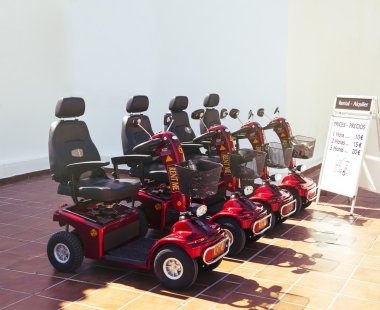 Electric scooters for senior people for rent. clipart