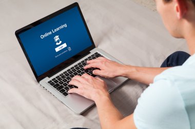 On line learning page in a laptop computer. clipart