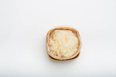 Thai sticky rice in a bamboo wooden on white background