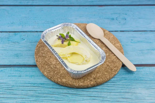 Homemade cheesecake with topping Durian fruit on a blue wood background
