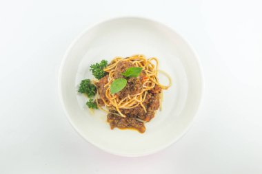 Spaghetti bolognese on a white plate isolated on white background