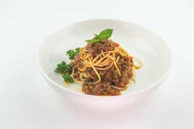 Spaghetti bolognese on a white plate isolated on white background