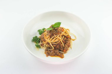 Spaghetti bolognese on a white plate isolated on white background