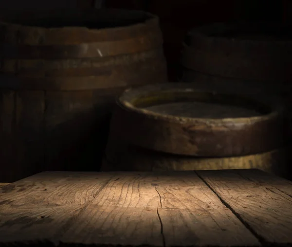 Background of barrel and worn old table of wood — Stock Photo, Image