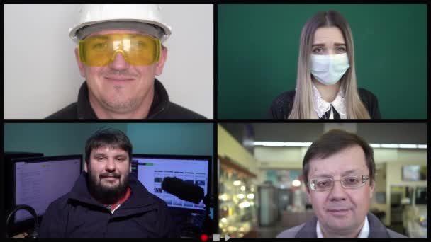 Группа использует технологию видеоконференцсвязи в офисе и в производстве для видеосвязи с коллегами во время пандемии коронавируса ковид-19 — стоковое видео