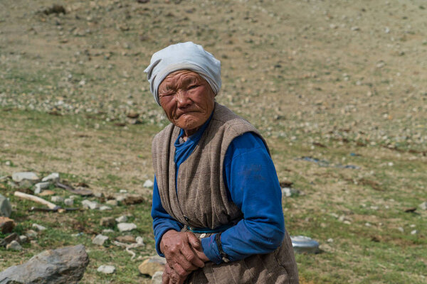 Mongolian elderly woman looking at the camera