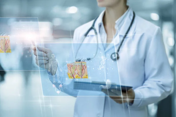 Dermatologist doctor works with skin anatomy in virtual computer interface on blurred background.