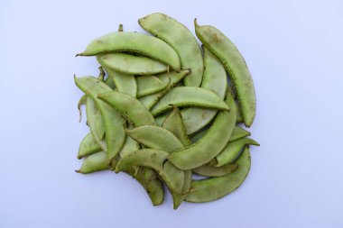 Hint papdisi olarak bilinen Hyacinth fasulyeleri veya sebzeli gujarati cuisne undhiyu yapımında kullanılan yiğit fasulyeleri. Geleneksel Asya tropikal sebzesi