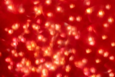 Yeni yıl ve Noel. Soyut arkaplan. Parıltı ve kırmızı Bokeh ışıkları bulanık. Tatilin kutlaması