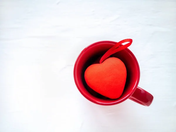 Valentines day concept with a red heart in a circle on a white background. top view. copy spase