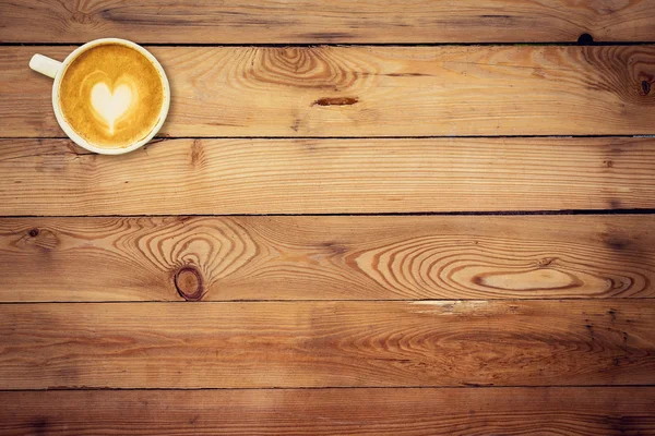 Bovenaanzicht koffie op houten tafel met ruimte — Stockfoto