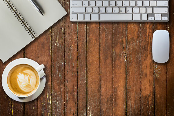 notepad, computer and coffee cup. View from above 