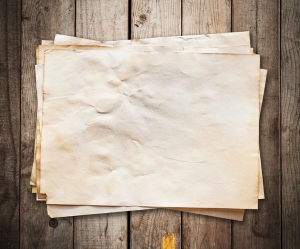 Old paper on wood background and texture — Stock Photo, Image