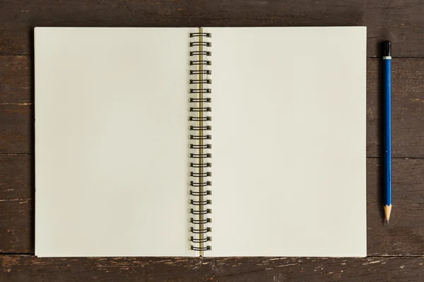 Brown open book with pencil on wood table — Stock Photo, Image