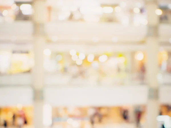 Blurred background image. shopping mall blur background with bokeh and vintage toned.