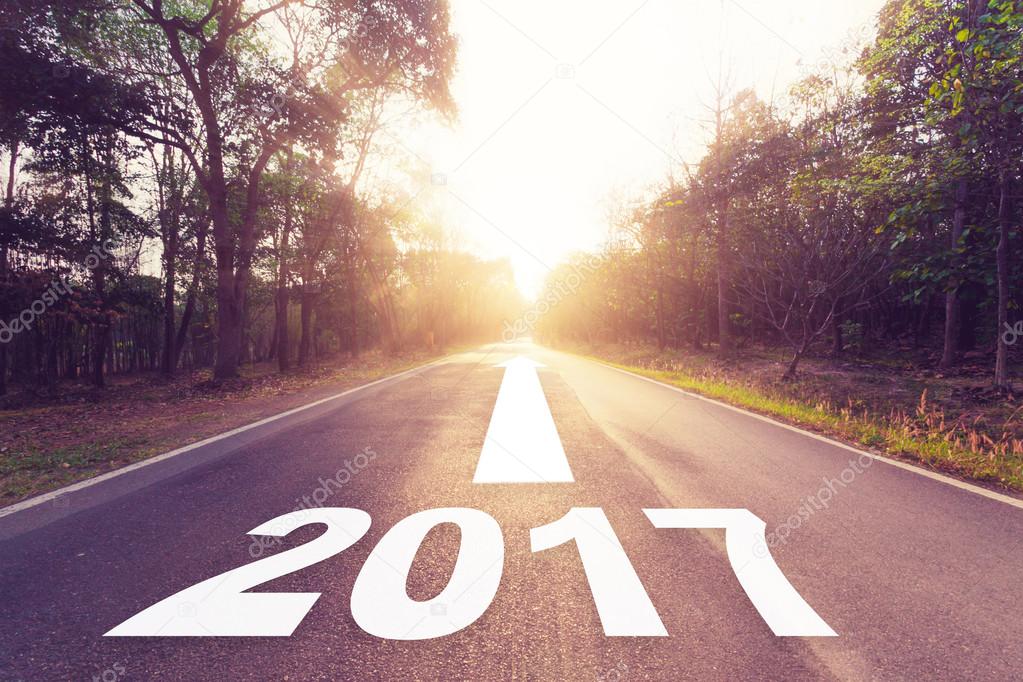 Empty asphalt road and New year 2017 concept.