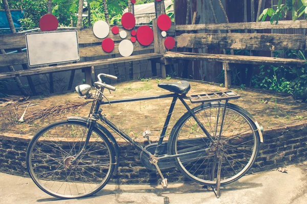 Old bicycle in coffee shop — Stock Photo, Image