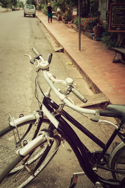 Vintage Bicycle Travel Resting in the city Street on Luang praba — Stock Photo, Image