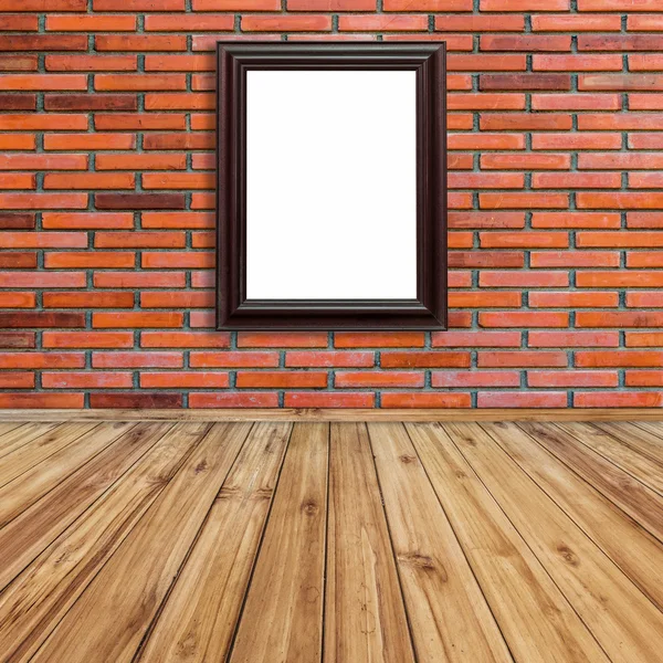 Marco de la foto en la pared de ladrillo rojo y fondo perspectiva de madera . — Foto de Stock