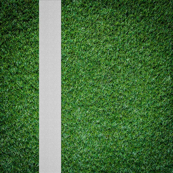 Witte streep op het groene voetbalveld vanaf bovenaanzicht — Stockfoto