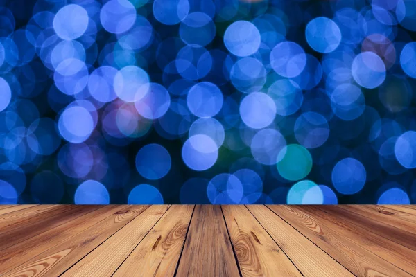 Tavolo in legno e astratto circolare bokeh sfondo notturno — Foto Stock