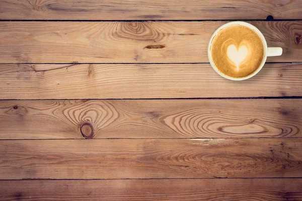 Koffie op houten tafel textuur met ruimte voor tekst — Stockfoto