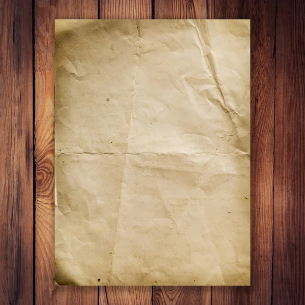 Old paper on wood background and texture — Stock Photo, Image