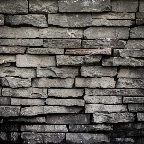 Old black brick wall background and texture — Stock Photo, Image