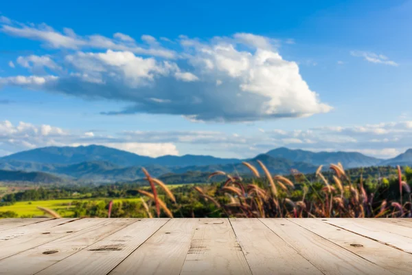 Abstract blurred and wood table, beautiful mountains landscape i — Stock Photo, Image