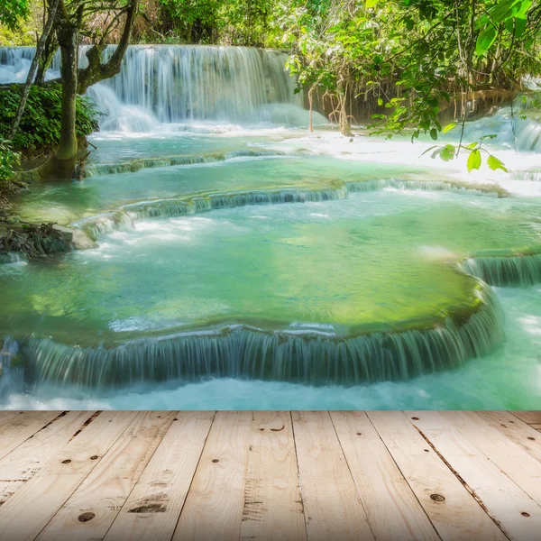 Wood floor and Waterfall in rain forest (Tat Kuang Si Waterfalls — Stock Photo, Image