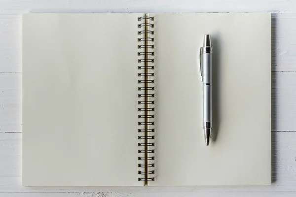 Brown book open and pen on white wood table — Stock Photo, Image