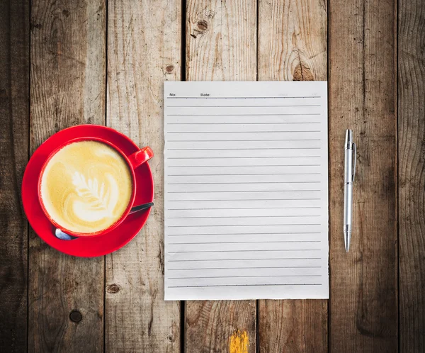 Empty paper and pen with red cup coffee on wood table background — Stock Photo, Image