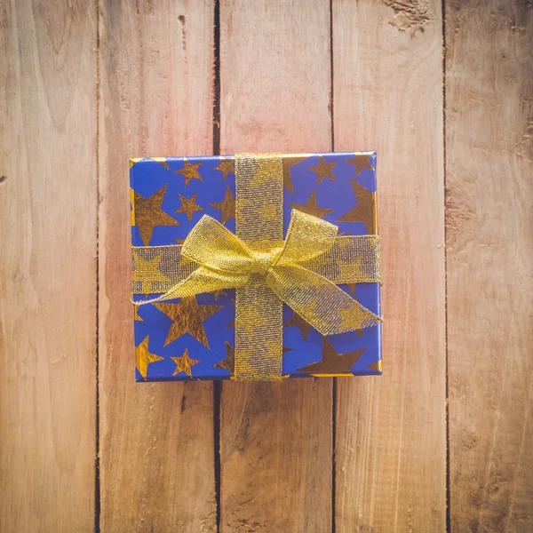 Gift box on wood background and texture — Stock Photo, Image