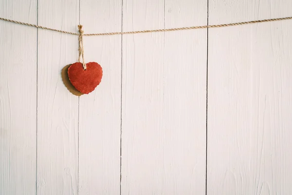 Heart on white wooden background with Vintage style. — Stock Photo, Image