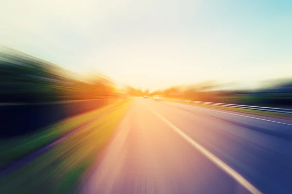 Abstract motion blur of the road with sunlight — Stock Photo, Image