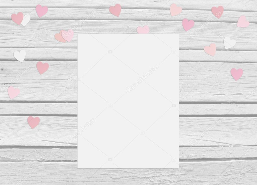 Valentines day or wedding mockup scene with blank card, paper hearts confetti and wooden background