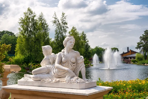 Marble statue of greek goddess and cupid — Stock Photo, Image