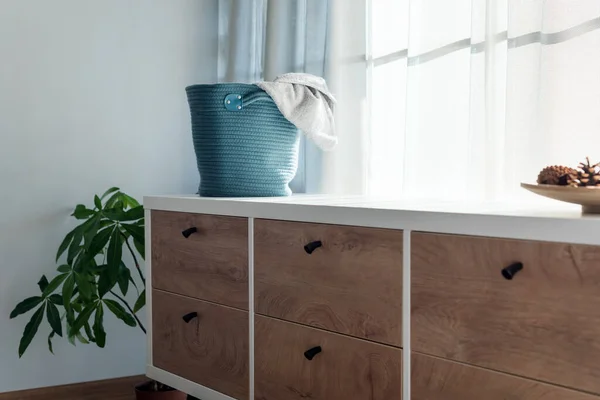 Laundry basket with gray towel. Interior of white stylish room with laundry basket — Stock Photo, Image
