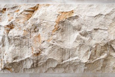 Taş zemin, kum duvar deseni. Sarı doğal taş cephesi, duvar fayansı