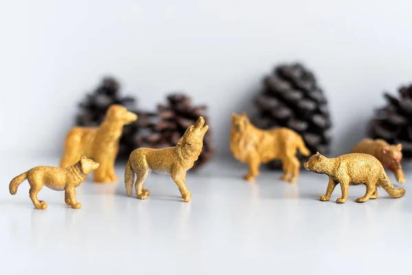 Golden Christmas Decorations Marten Wolf Figures Models Toys Pine Cones — Stock Photo, Image