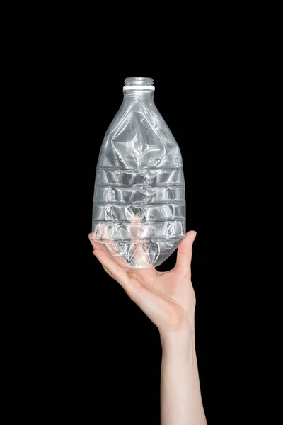 Female Hand Holding Empty Crushed Plastic Bottle Isolated Black Background — Stock Photo, Image